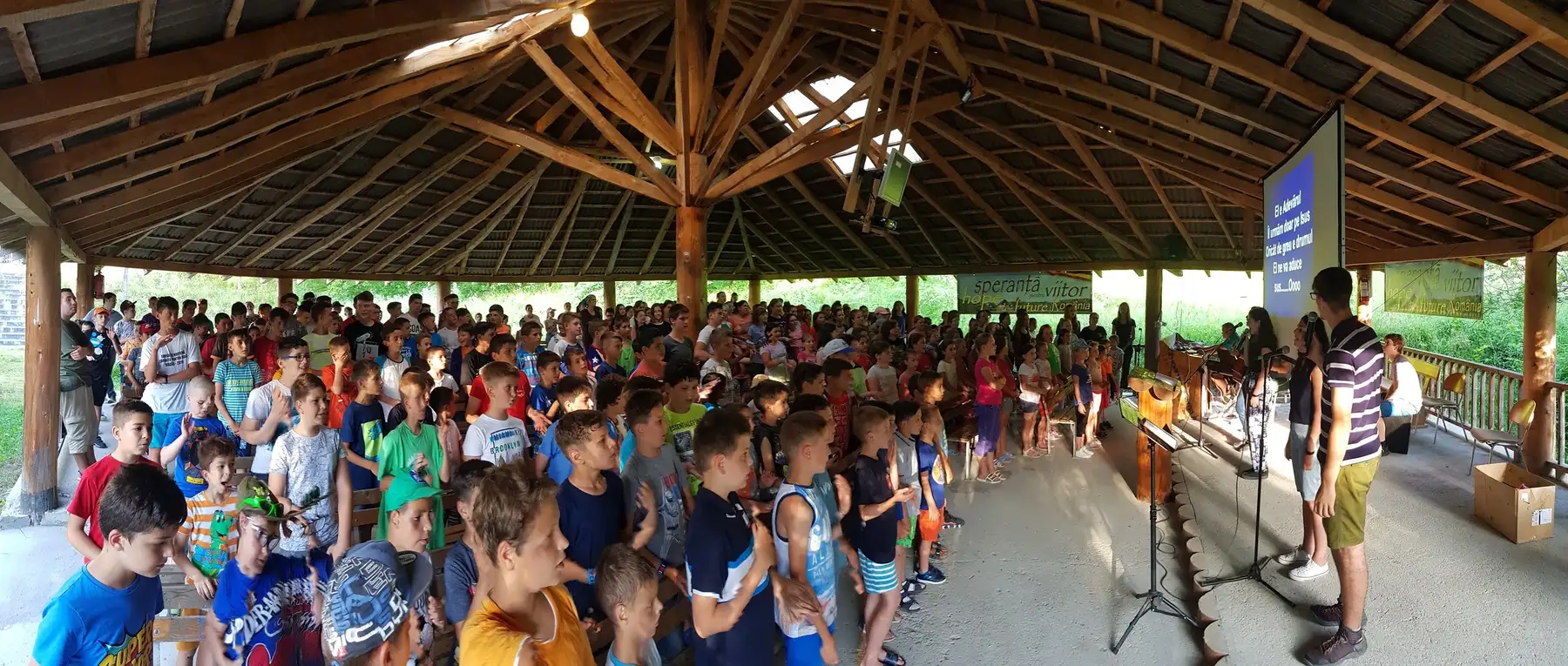 Hundreds of children gathered under the open pavilion at camp