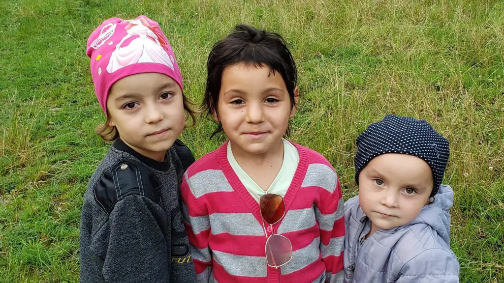 Three young children at camp